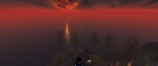 A huge marbled amber moon low over a red sea, me on a cliff in the foreground.