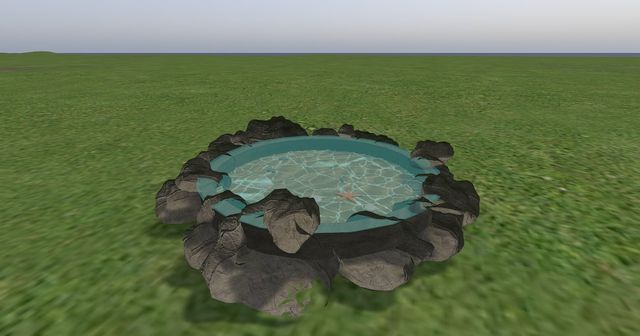 The tidepool: a ring of rocks around shallow turquoise water.